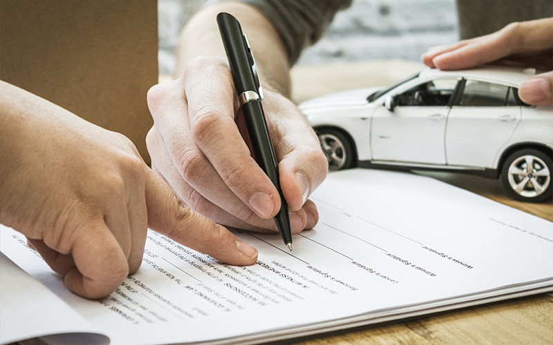 Signing a corporate car leasing package agreement.